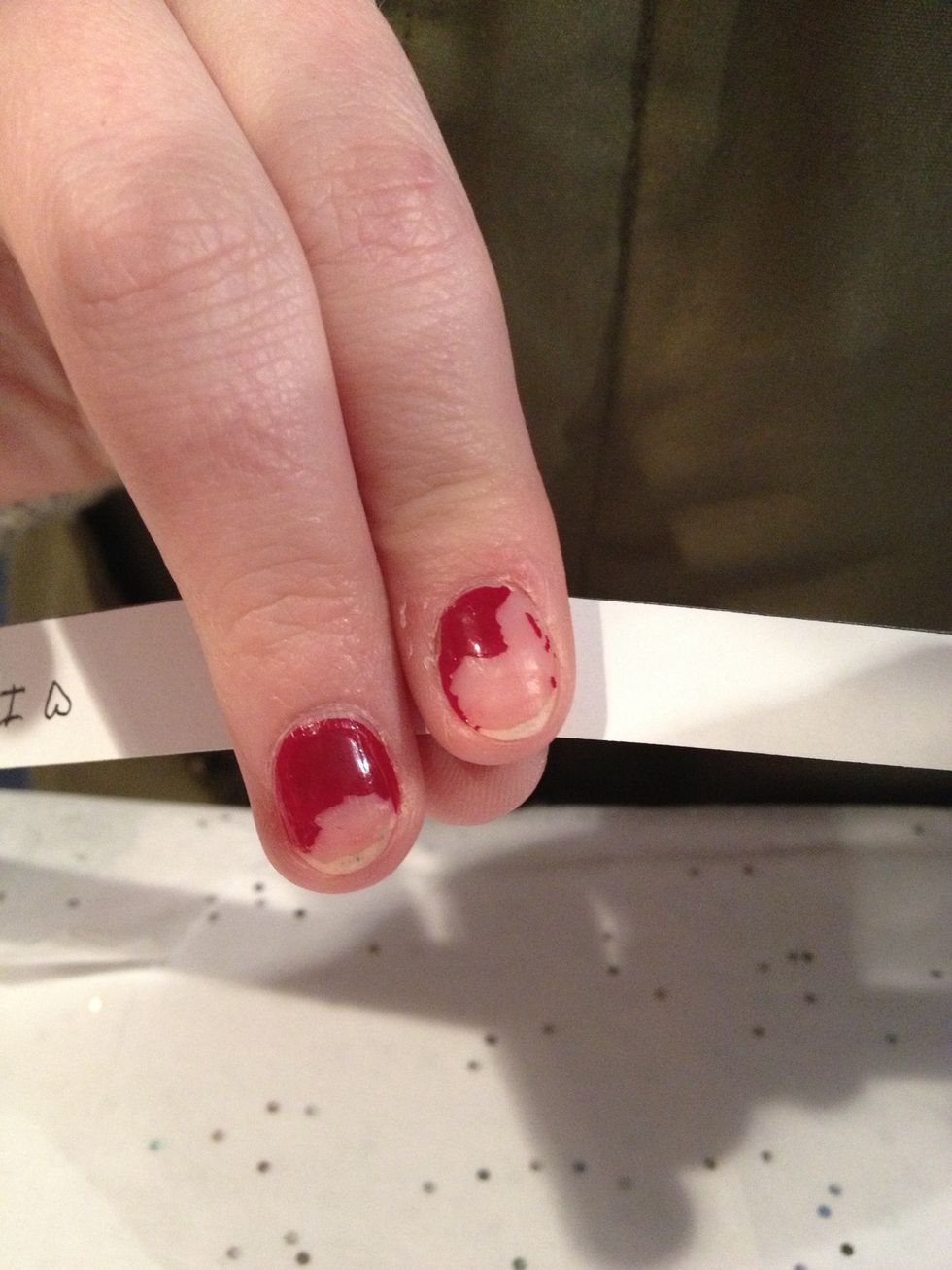 Then you take it with two fingers and hold on the outer of the stripe