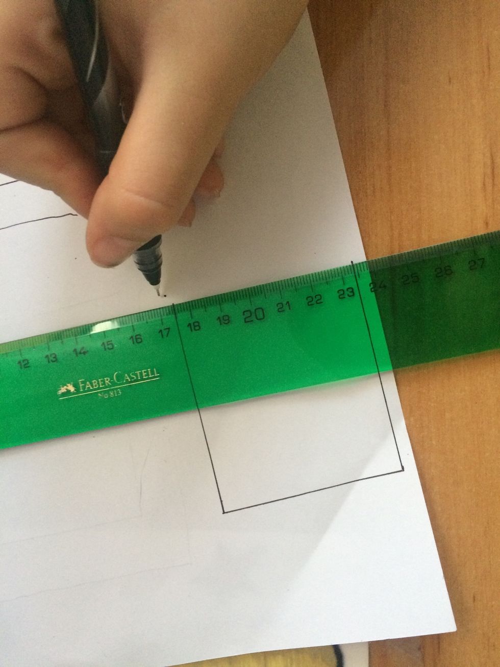 Then you want to make a similar (but smaller) shape on the white paper.