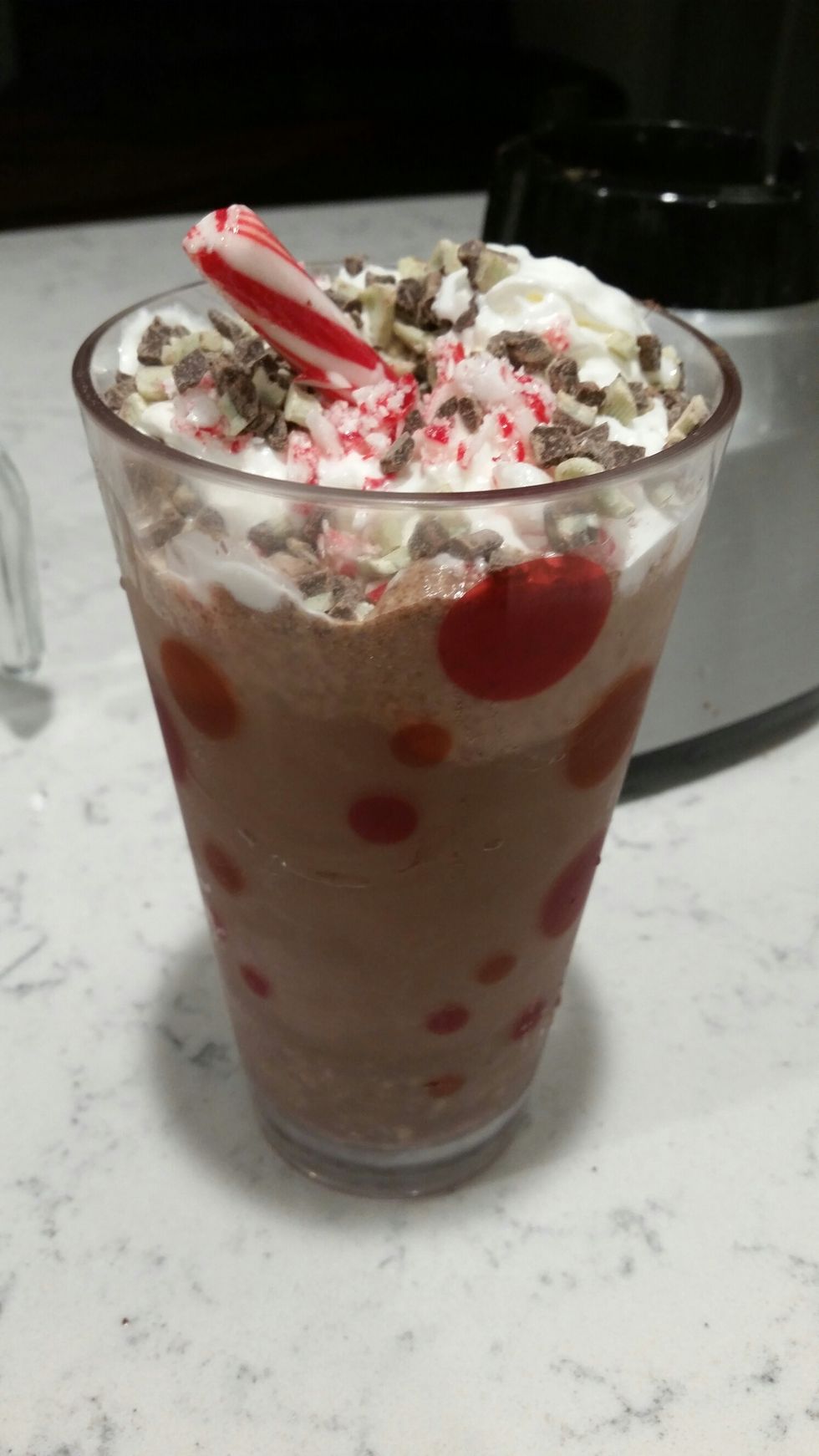 Then your done! you can add as much whip cream and chocolate chips as you want and then i added a big piece candy cane