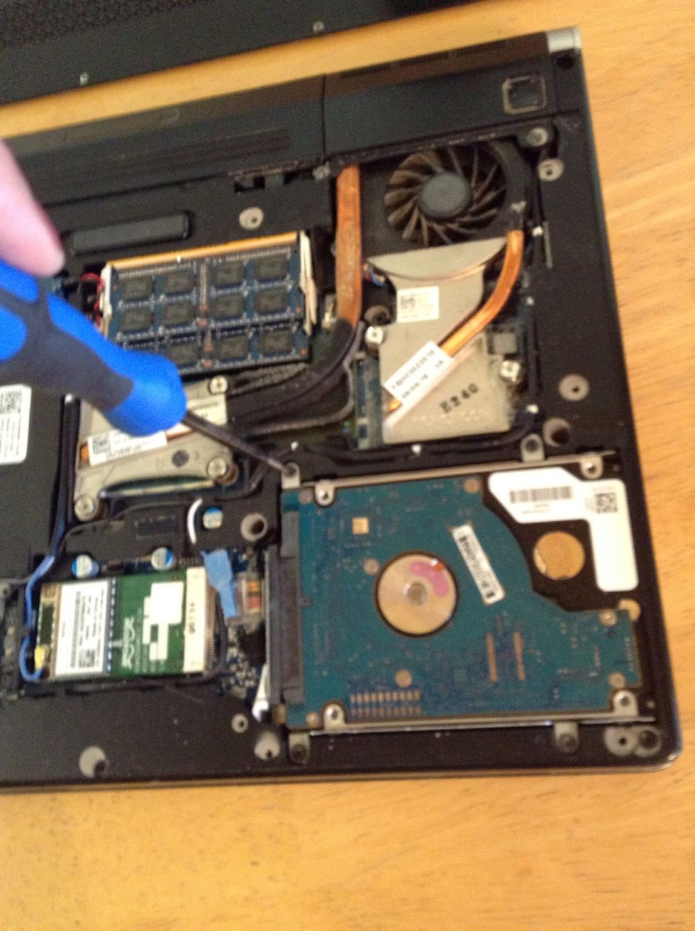 There are 4 more screws around the hard drive to be removed.