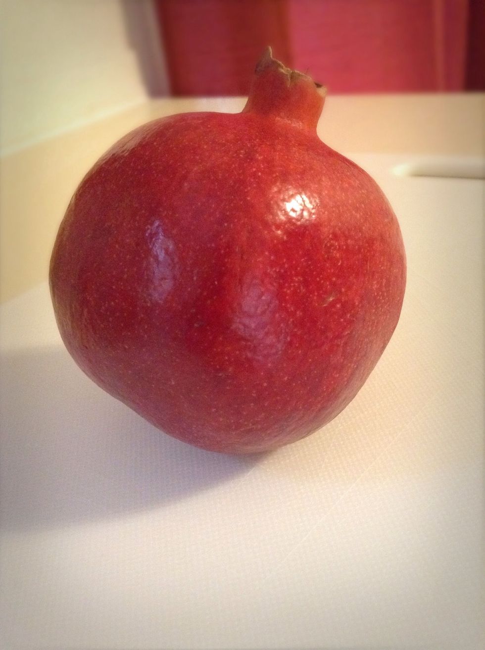There are a few ways to get the seeds out but I find this way has to be not only the easiest AND fastest but also it doesn't make a mess :)! Now, let's get started!! Grab your pomegranate.