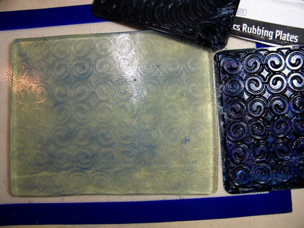 There are an infinite number of techniques, I could go on and on. But I will show you one more.  Rubbing plates can be purchased at art supply stores and are perfect with Gelli Plate printing.