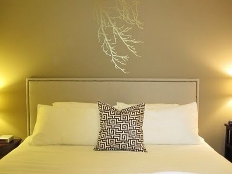 There are some well taylored headboards out in the market that can give you a modern hotel suite look.
