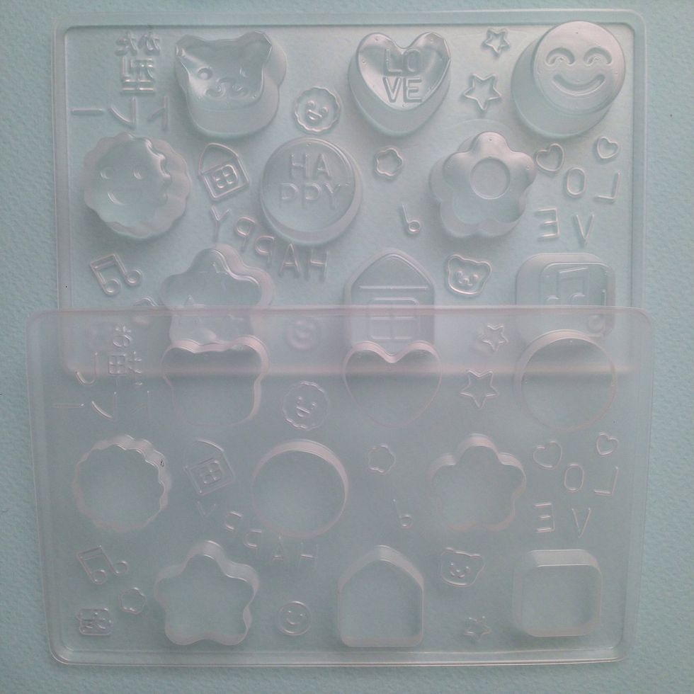 There is a top and bottom to the mold- - after you add your powdered candy you squeeze the molds together
