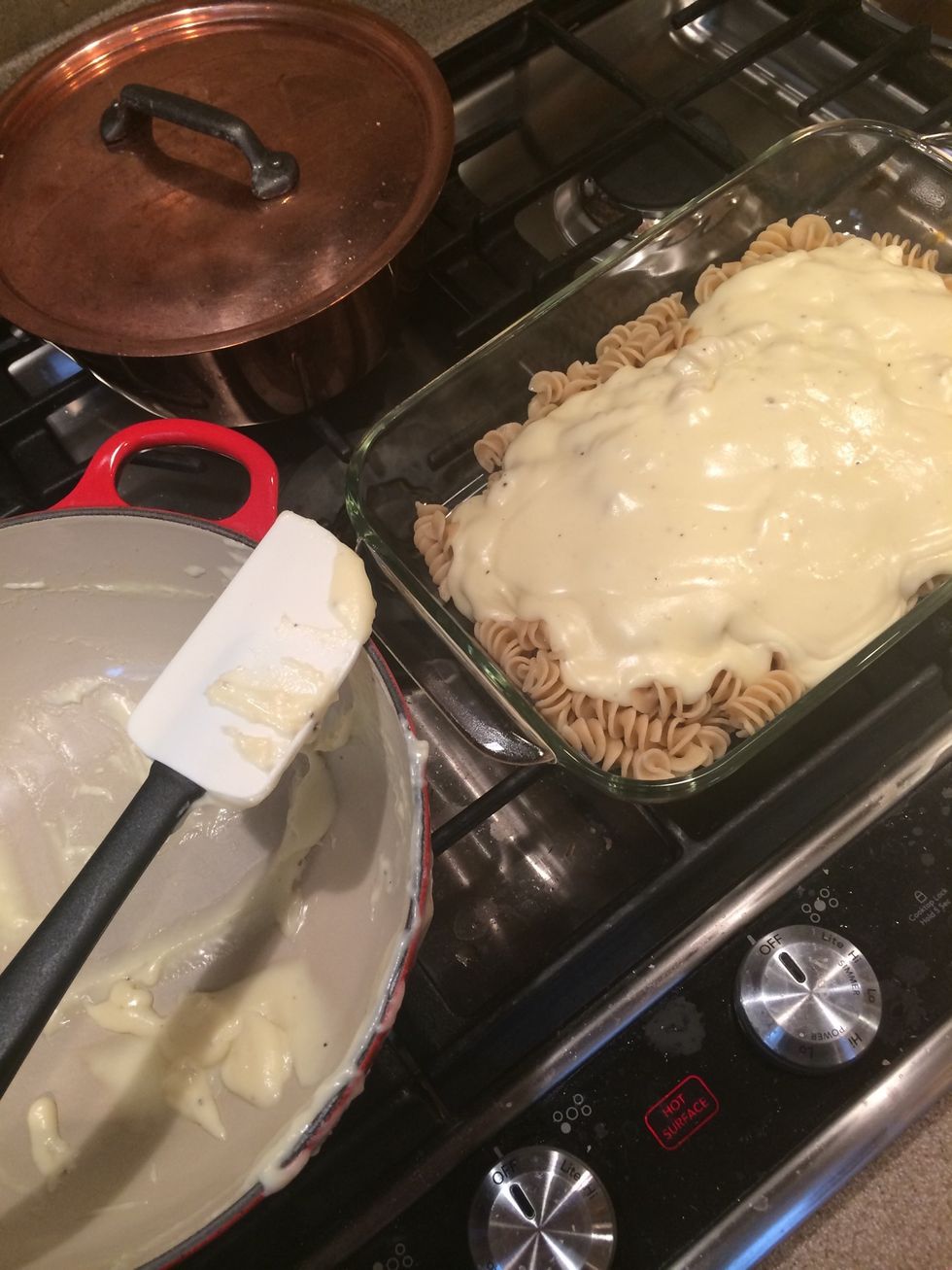 There is that baking dish and the cooked pasta I mentioned. Pour the sauce over! And make sure you sample the cheese sauce!