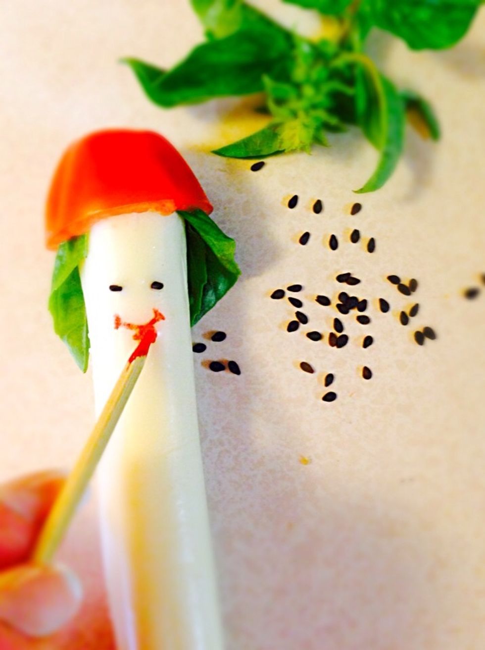 There...lol I used wooden skewer dipped in food coloring to draw a mouth and basil leaves for fisherman's hair. Eyes I made from black sesame seeds