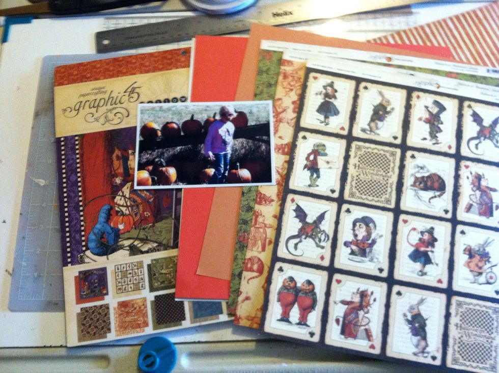 There's another contest on the Graphic 45 Facebook page so as I worked on my layout, I took photos. Here I'm choosing which paper and card stock to use with my pumpkin patch picture.