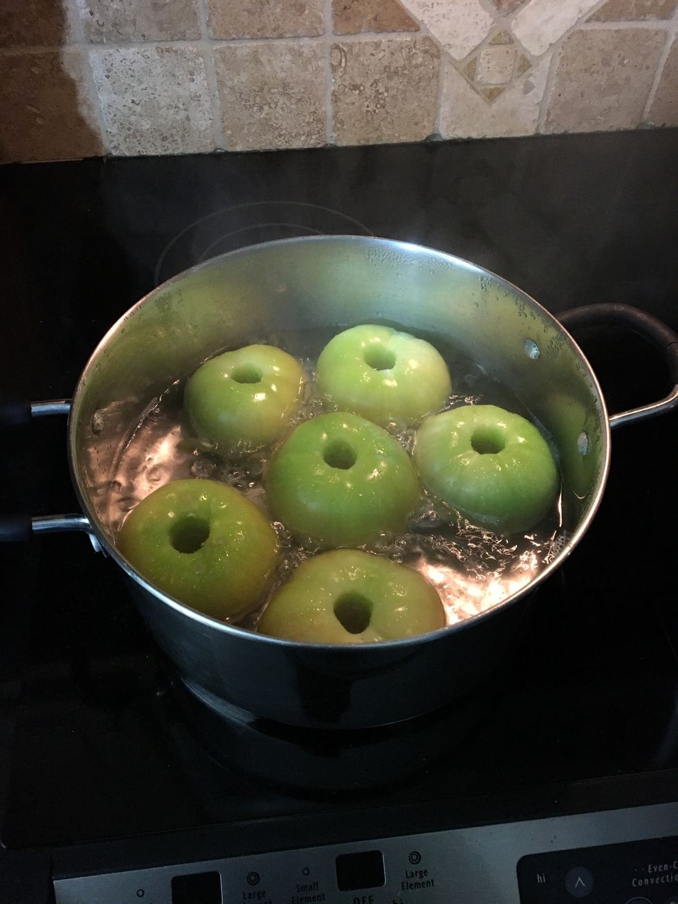 There were multiple processes but I chose to boil cored tomatoes to remove skin.
