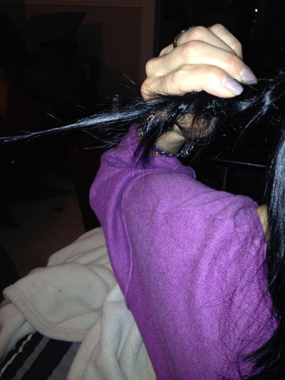 There will be a small string of hair which you should clip under your hair