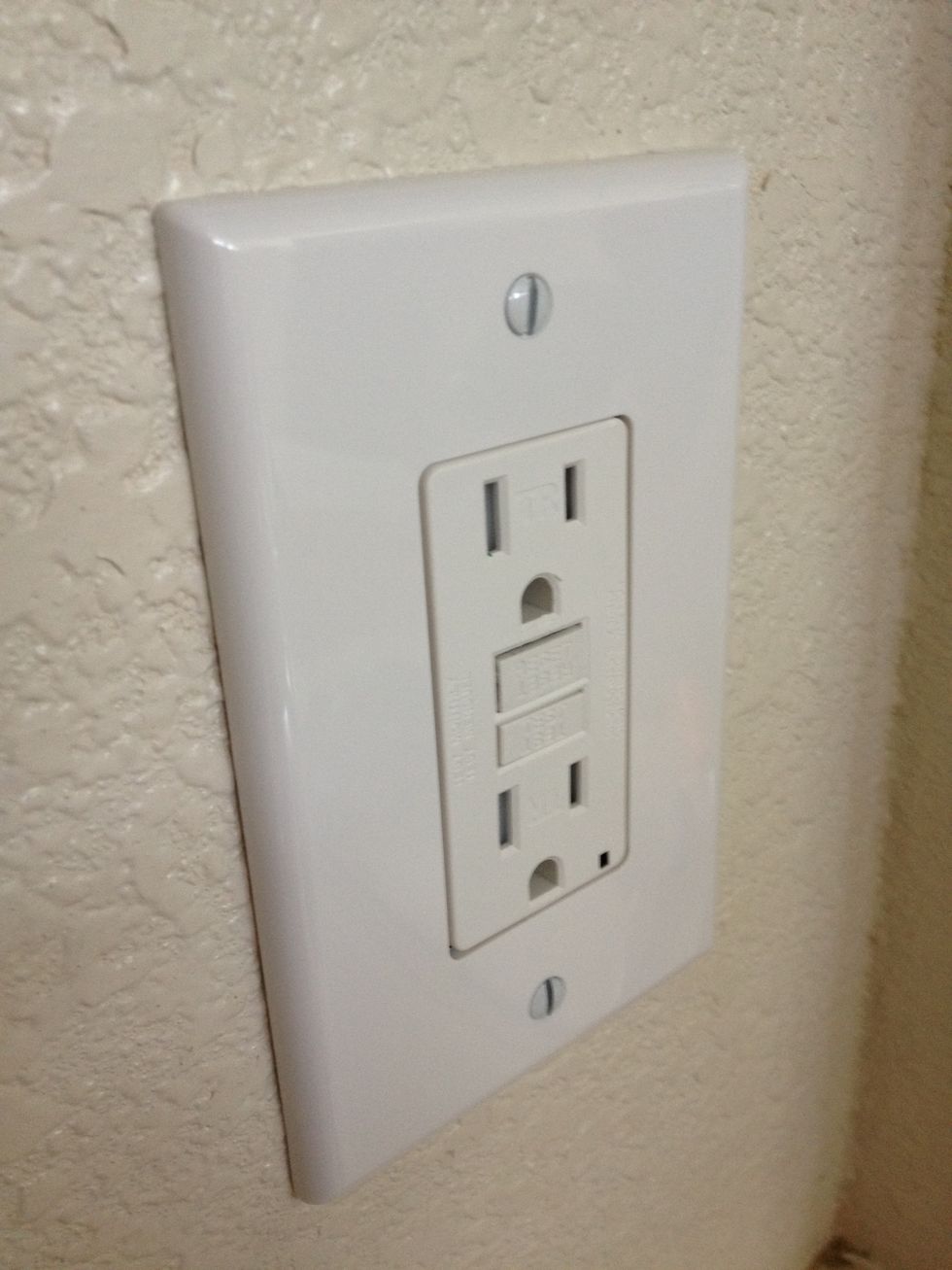 There you have it! No need to over tighten the screws on the cover plate. They will warp the cover plate which is undesirable. Also, I made sure the slots in the screws pointed North/South. Classy.