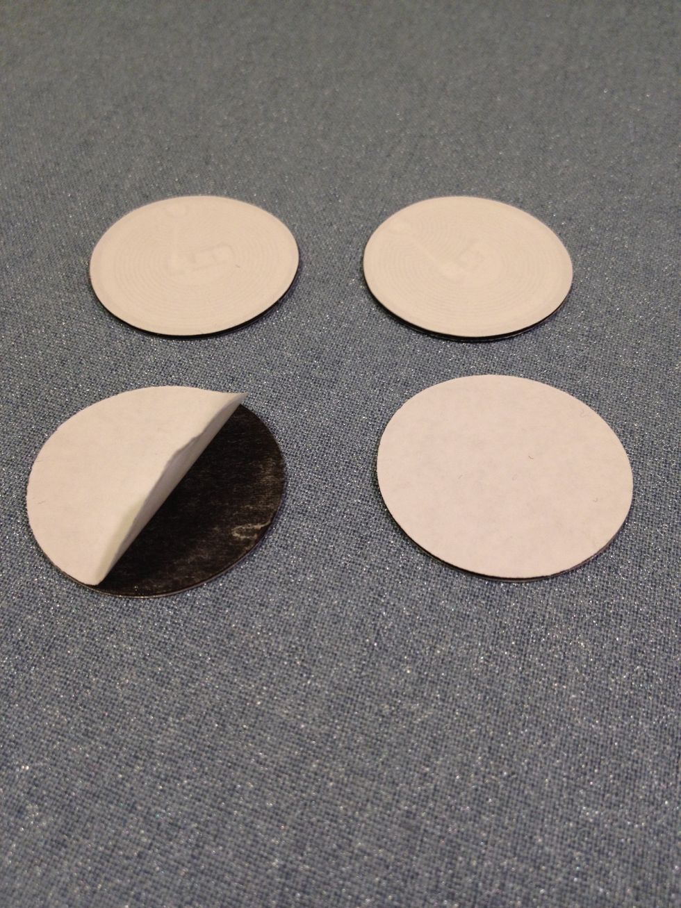 These are "anti-metal NFC stickers" purchased from tagstand.com. Because they are going to be placed on the radio frequency blocking fabric, we need the extra isolation on the NFC tag.