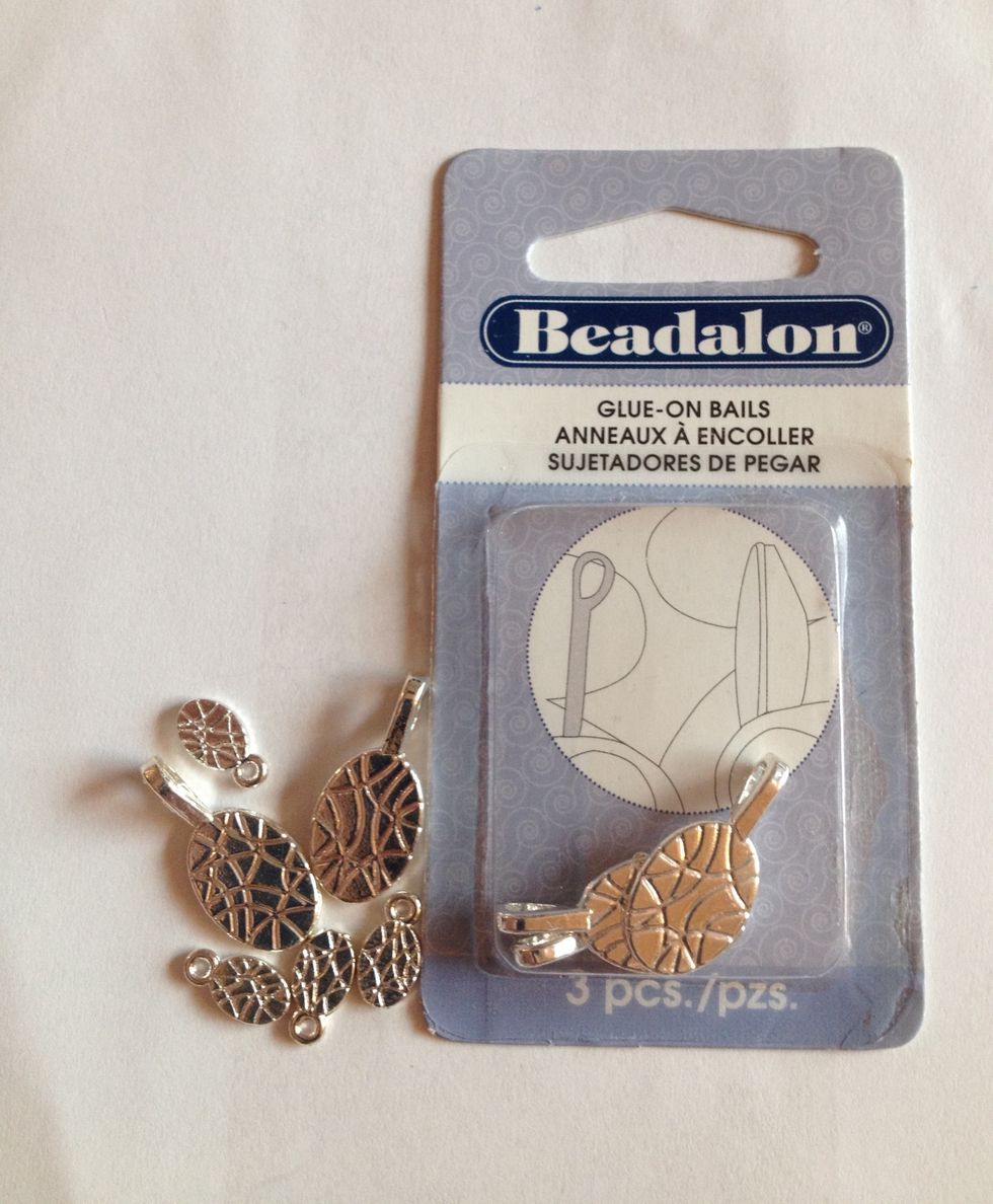 These are bails. You can buy them in different sizes at any craft store or online. These will help you turn your pieces of glass into necklaces. Plus...