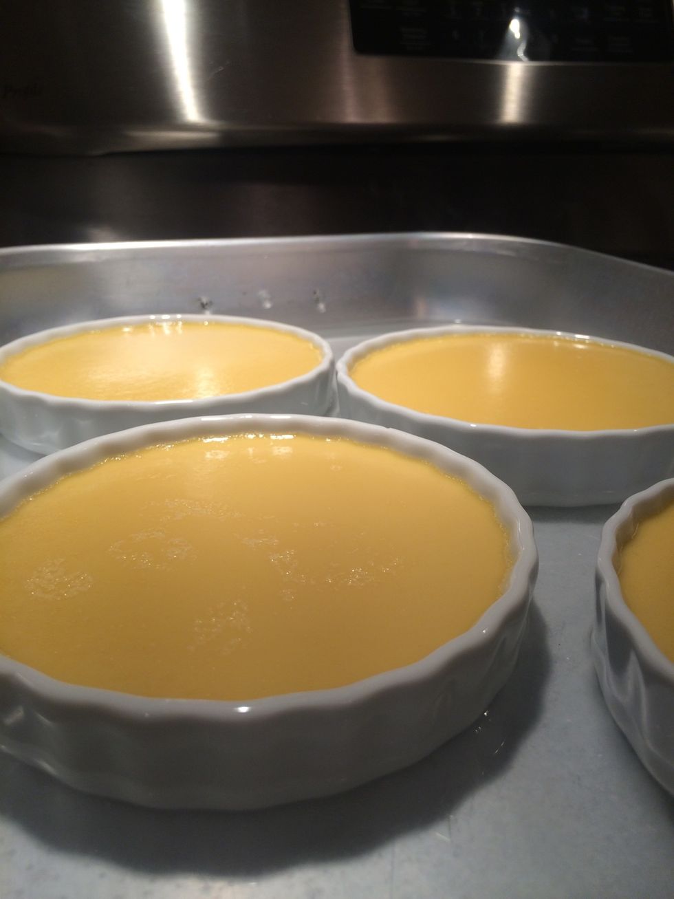 These are done. Let them set in the water bath for 15 minutes. Remove custard dishes from roasting pan and refrigerate for several hours or over night until they are completely chilled.