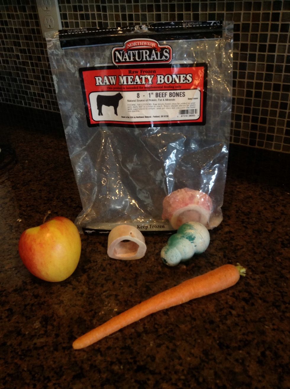 These are his favorite treats. The Kong frozen with peanut butter, frozen carrot chunks, frozen apple slices and his bones. Even after he's chewed all of the meat off he still loves them.