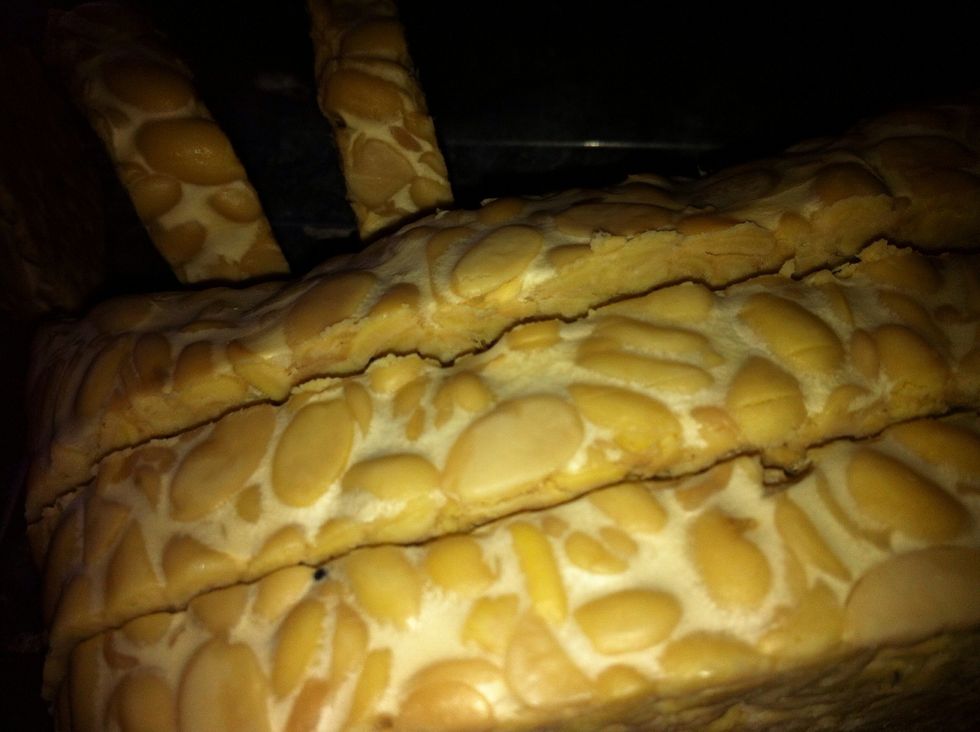 These are tempeh, which are fermented soy cakes. It's usually used in Malay or Indonesian cooking. It is a good source of protein.