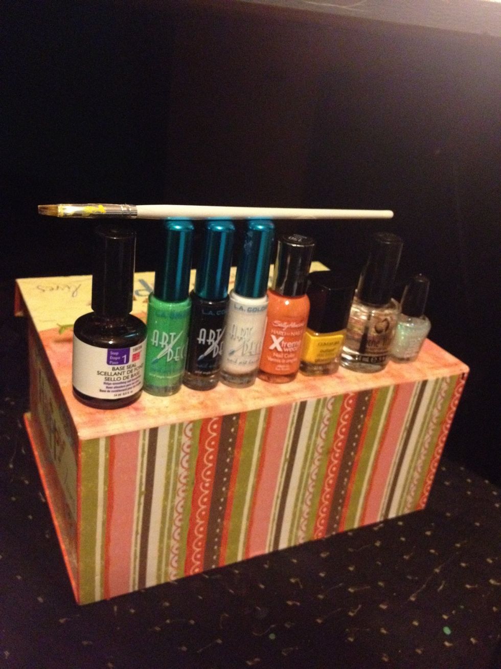 These are the colors I'll be using. Glitter polish is optional. Go ahead and apply your base coat to all toe nails.