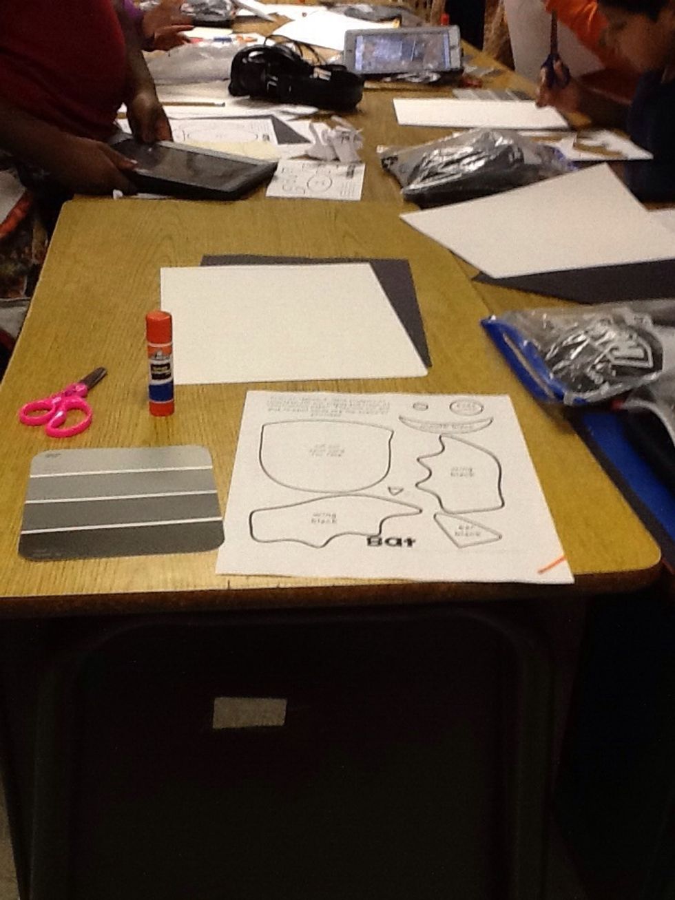 These are the materials you will need to make a Halloween bat you will need glue scissors bat template spray paint card black and white construction paper.