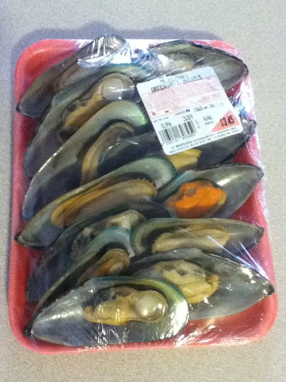 These are the mussels I get. For some reason, they are sold on the half shell, so I just pluck the meats & throw out the shells before I start. In case you can't see that price, it's $3.45 a dozen.