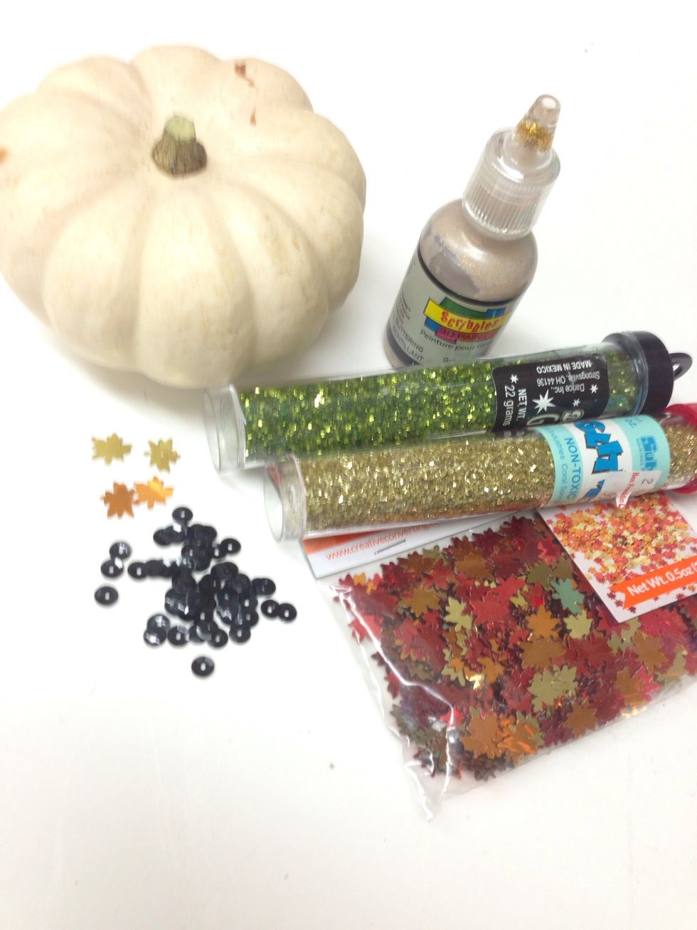 These are the supplies you will need to make a sparkly pumpkin. You can find mini pumpkins right here at Ben Franklin Crafts or at a farmer's market.