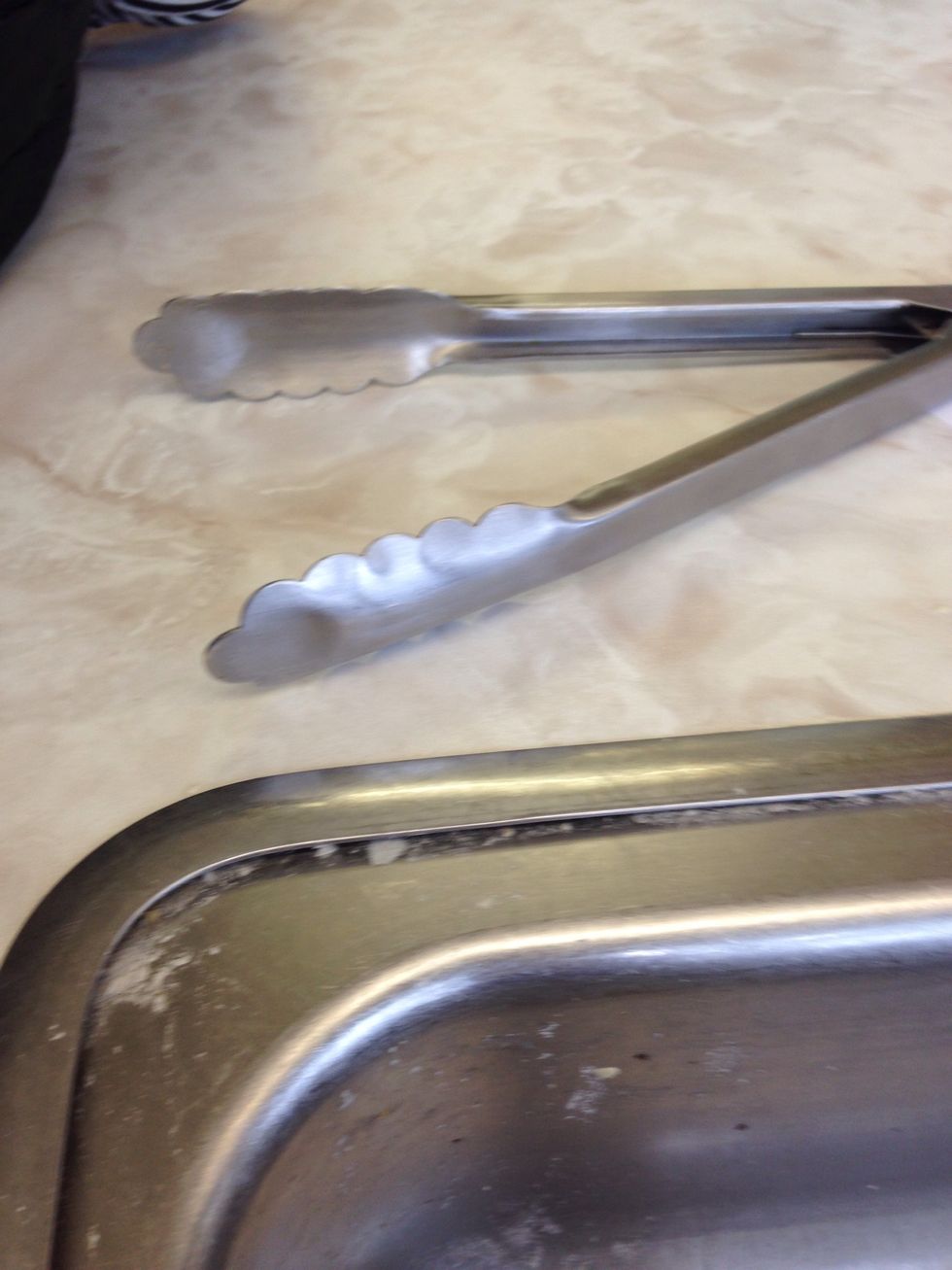 These are tongs. They are use to pick up food easier. I can use tongs to pick up or grip food.