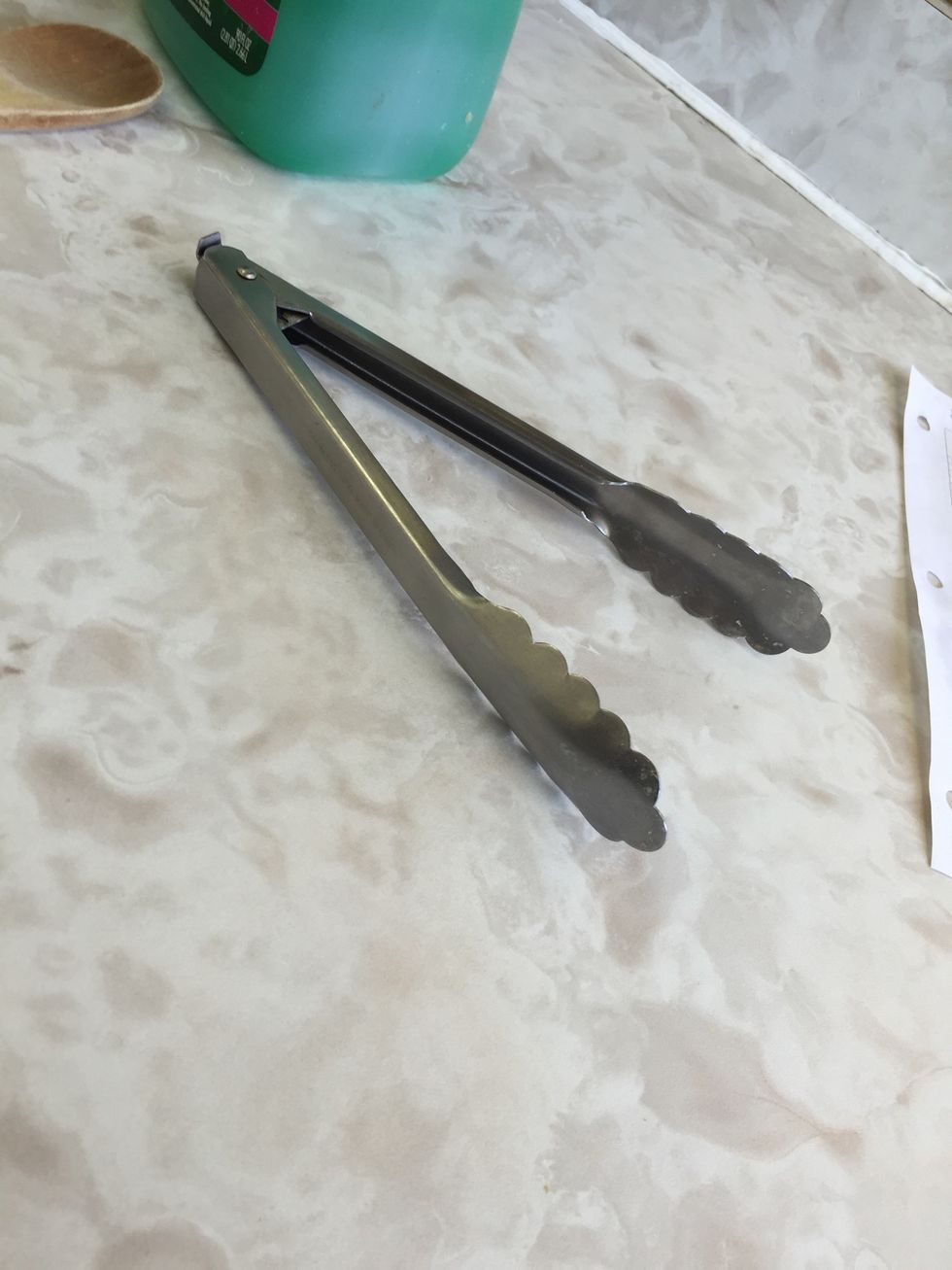 These are tongs. Used for grabbing things without touching it with are hands. I can use a pair of tongs to grab things.