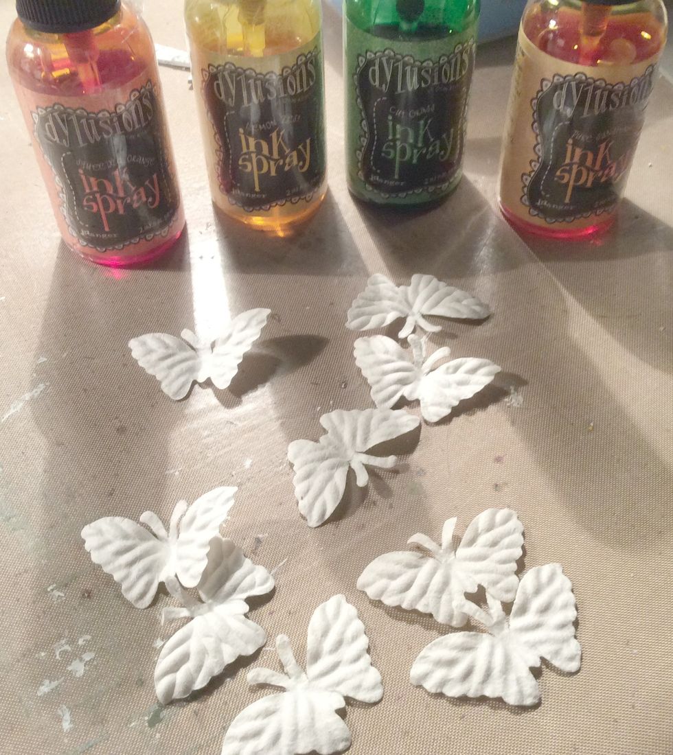 These butterflys are from "I am Roses". I used 3 for each butterfly for layering. Using a paint brush, apply your inks. The Dylussions are beautiful and vibrant.