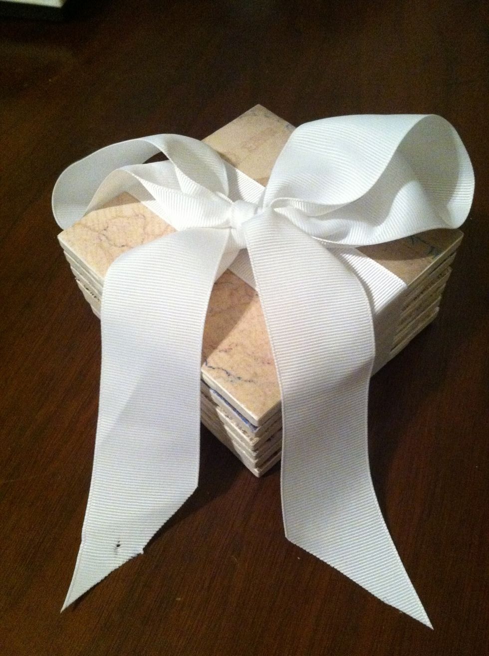 These make a great gift! Modge Podge takes a month to cure. You can't put anything hot on these until they're cured. If you want to have them cure faster, use a clear, acrylic, spray sealant.