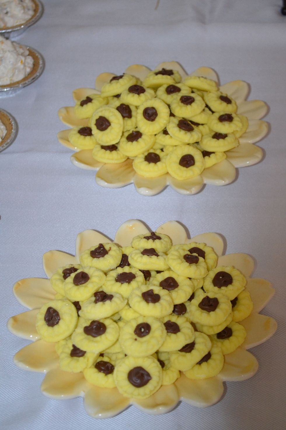 These mints are so easy to make and taste so yummy.  It is a recipe from Pinterest with a few tweaks, like adding the melted chocolate. The sunflower plates were bought at a yard sale.
