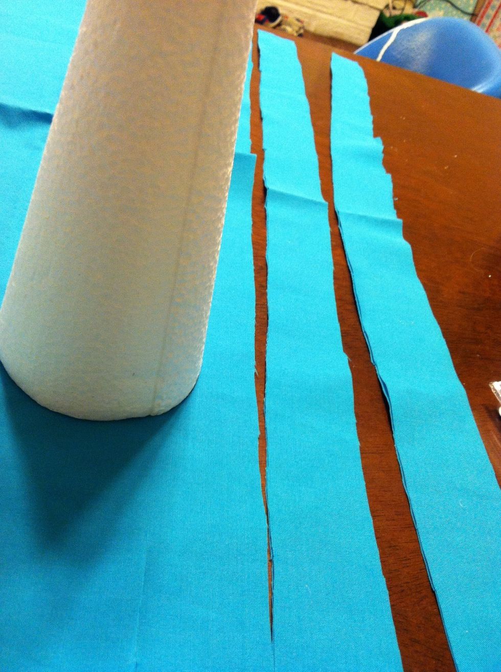 These super easy trees require no exact measuring. Just cut strips of fabric based on the size cone you are using. I used scrap fabric I already had and the cone came from the dollar store!