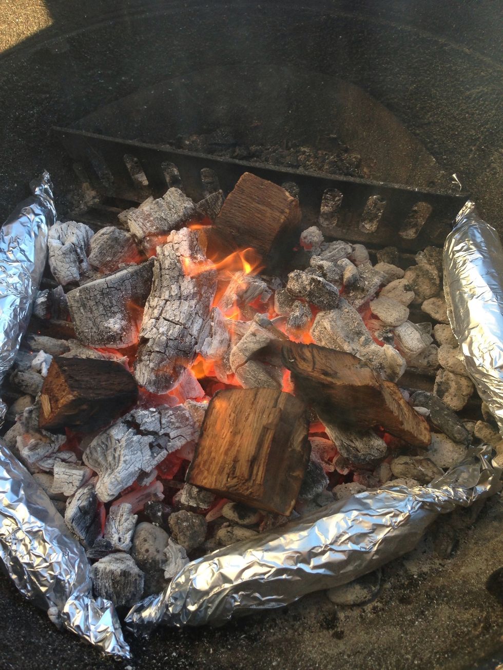 They're cooking! Live fire (in this case with hardwood  lump charcoal) is a great way to cook - you can use the coal area as well as the grill grate to cook!