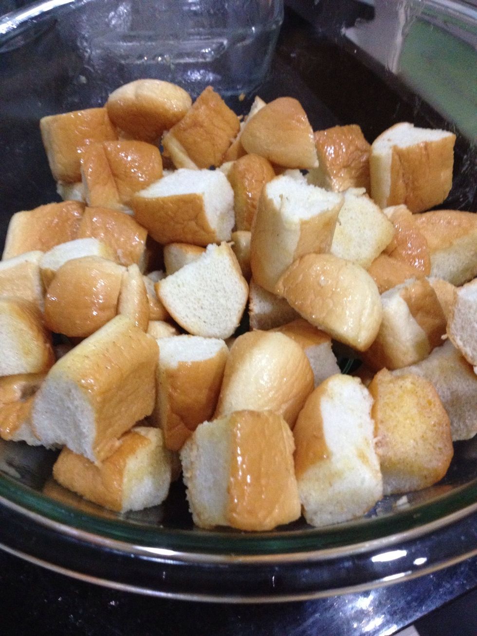 They should each get a light coating. We don't want too much butter or too much cinnamon. Then put them back into the previous dish.