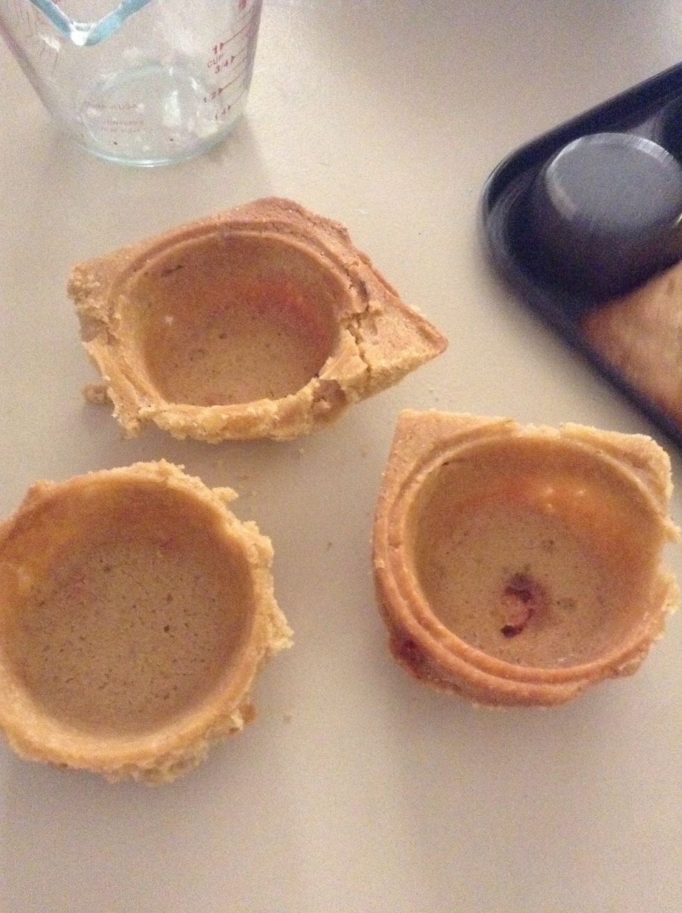 They should look something like this when taken out of the tray. You can bite the excess cookie around the top to get a rounded top.