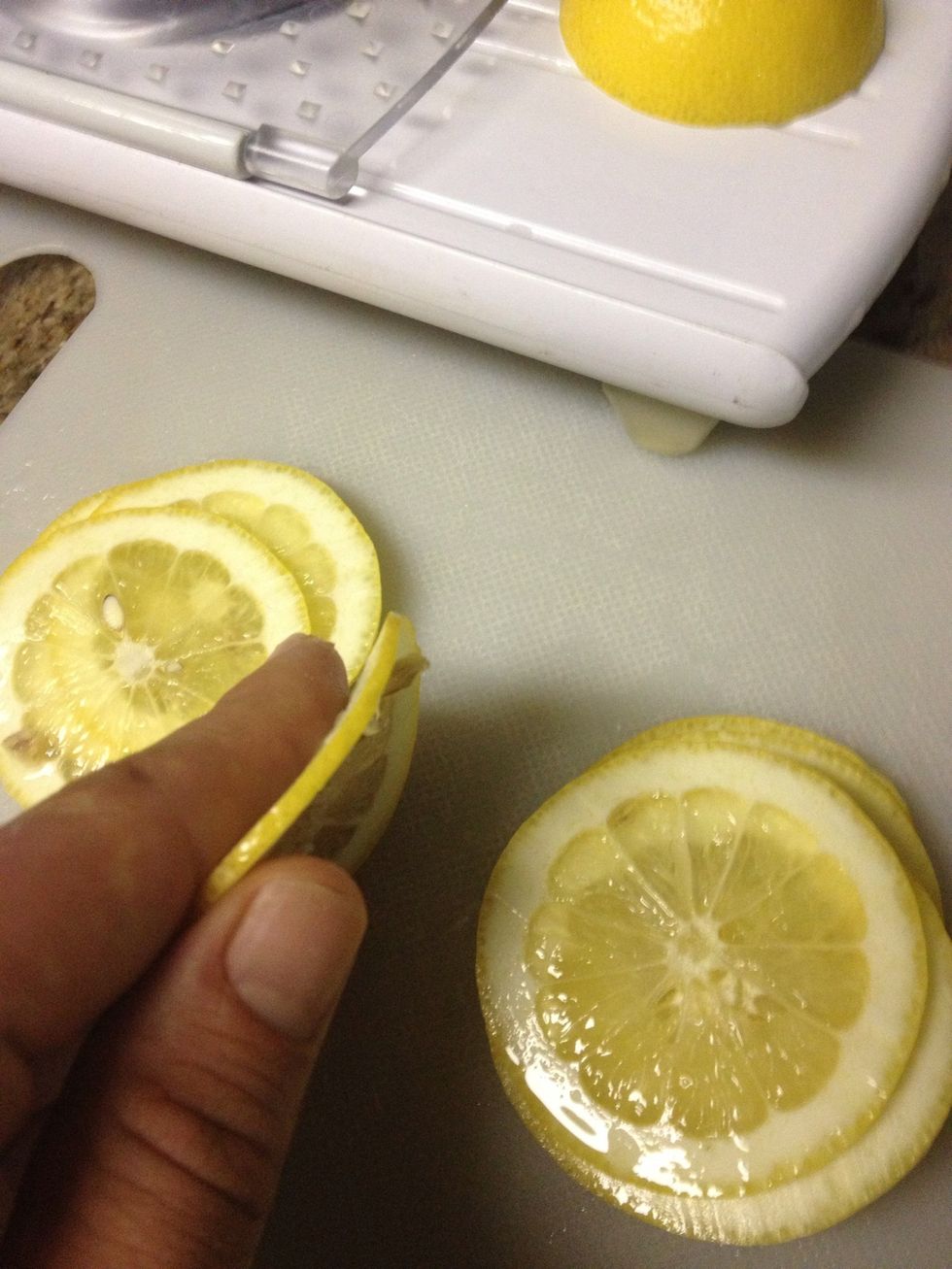 Thin slice lemon as well. You can eat the lemon slices whole when it's this thin, but I prefer to remove the peel and pith.