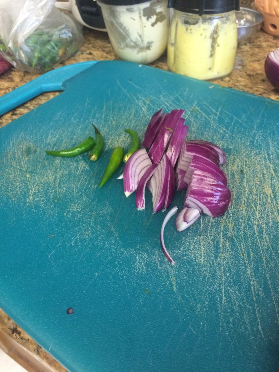 Thin slice red onion and cut tops off green chile. Saut\u00e9e in 1/2 butter 1/2 oil