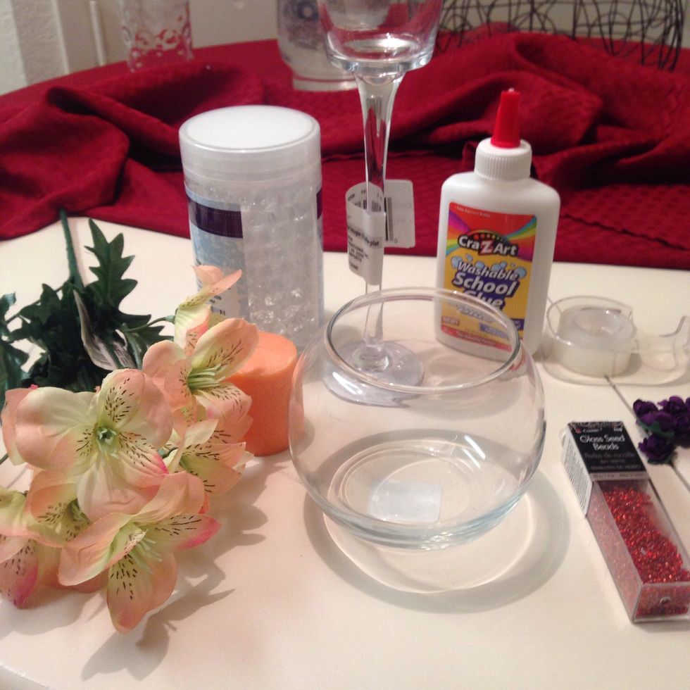 Things you need. I didn't end up using everything in pic. Btw, I got everything from the dollar store, except for the candle and the purple tiny flowers.
