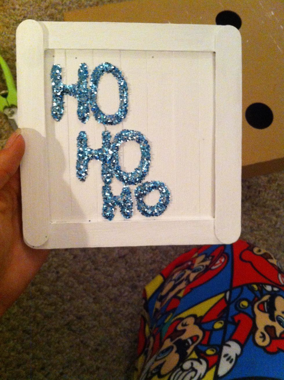 Think of a Holiday saying or phrase that you like and write it out in Elmer's glue. Then cover it in glitter and dust off the excess.