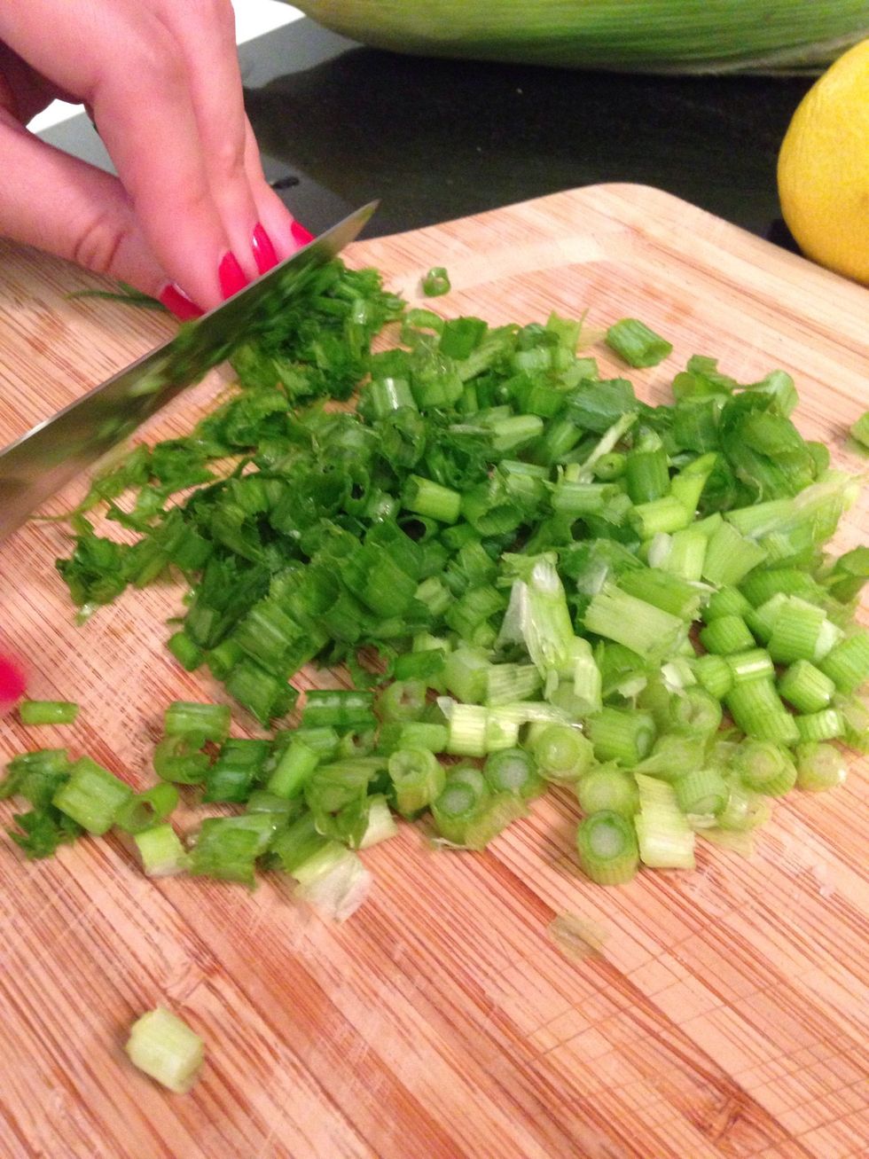 Thinly cut the scallions divide into white bottoms and green tops