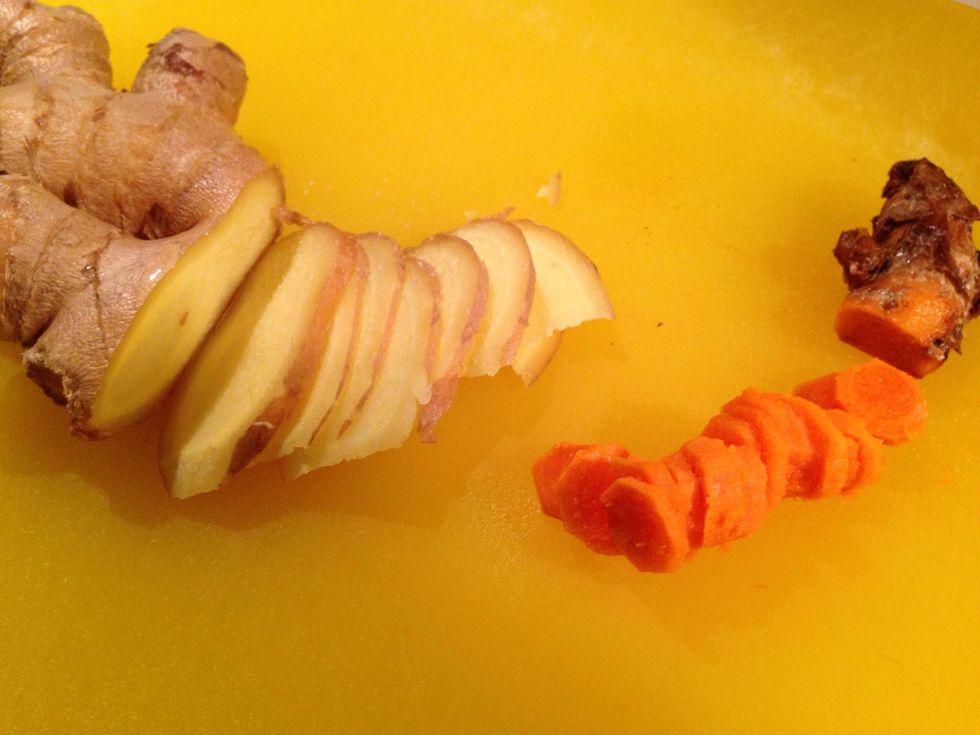 Thinly slice ginger (keep peel on). Peel brown coating off of turmeric then thinly slice.