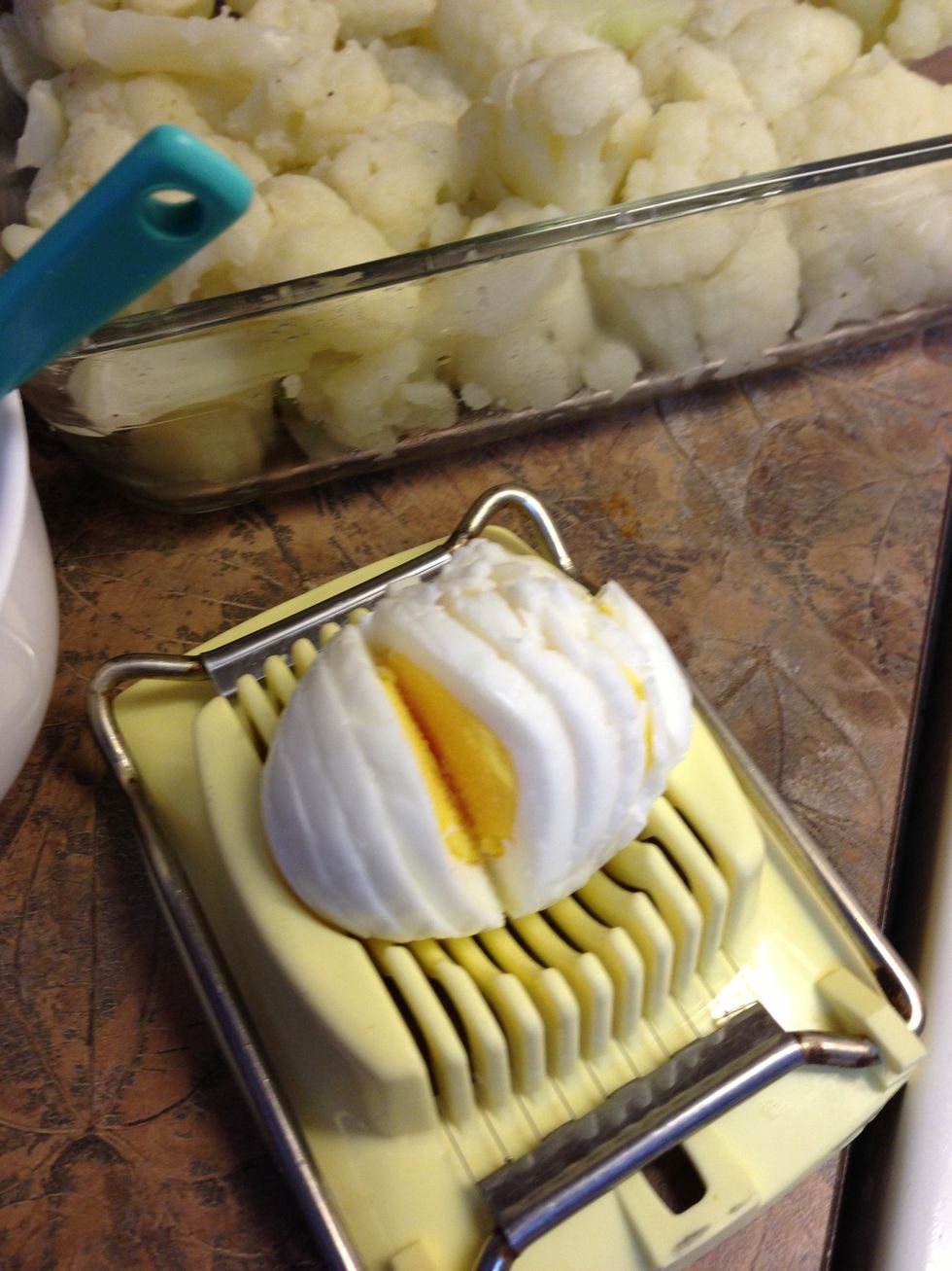 Thinly slice hard-cooked eggs.