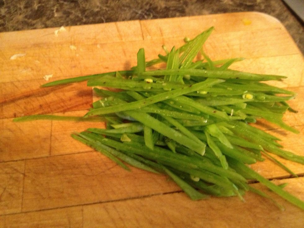 Thinly slice into stops lengthwise.