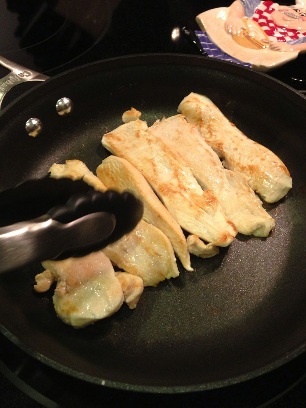 Thinly slice the chicken breasts and saut\u00e9 over medium-high heat until cooked through.