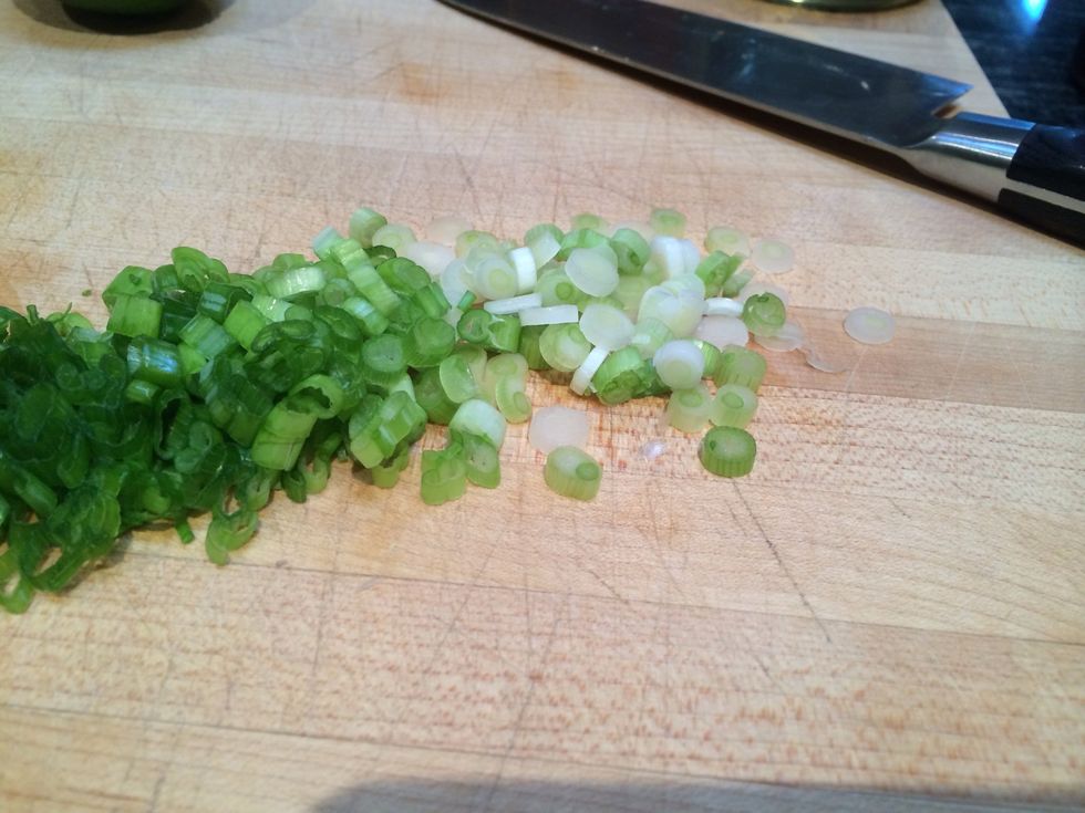 Thinly slice the scallions.