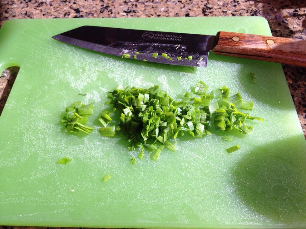 Thinly slice the scallions.