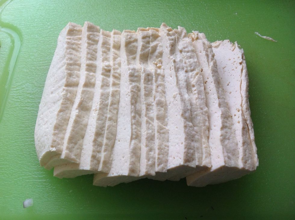 Thinly slice the tofu.