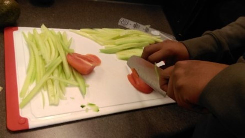 Thinly slice the vegetables, til they resemble matchsticks (Julienne)
