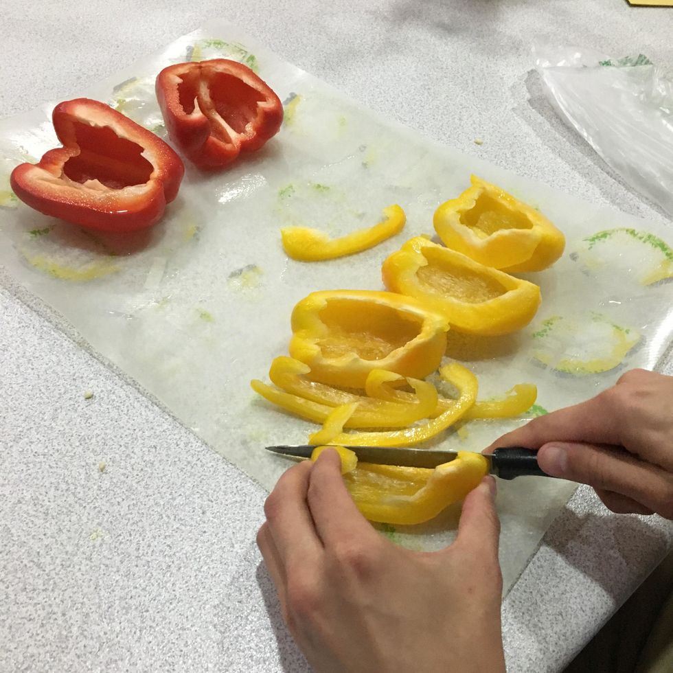 Thinly slice the yellow and red bell pepper