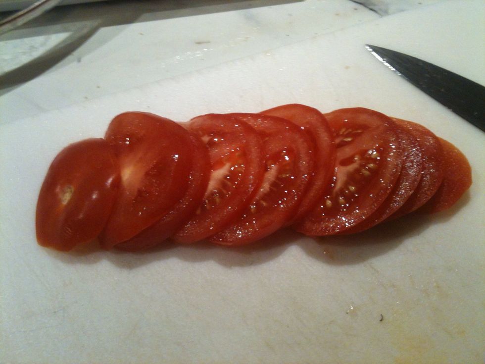 Thinly slice tomato.