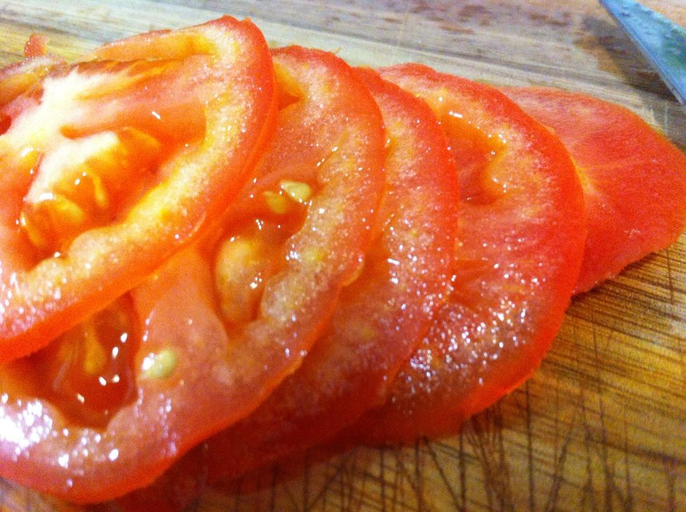 Thinly slice your delicious, ripe tomato