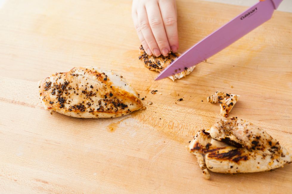 Thinly slice your grilled chicken into small, bite-size pieces.