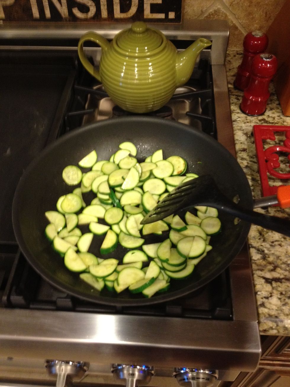 Thinly slice your zucchini and saut\u00e9 in a little bit of olive oil